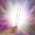 http://www.dreamstime.com/royalty-free-stock-photography-holding-tuning-fork-resonating-energy-field-female-hand-upright-light-behind-image48827407
